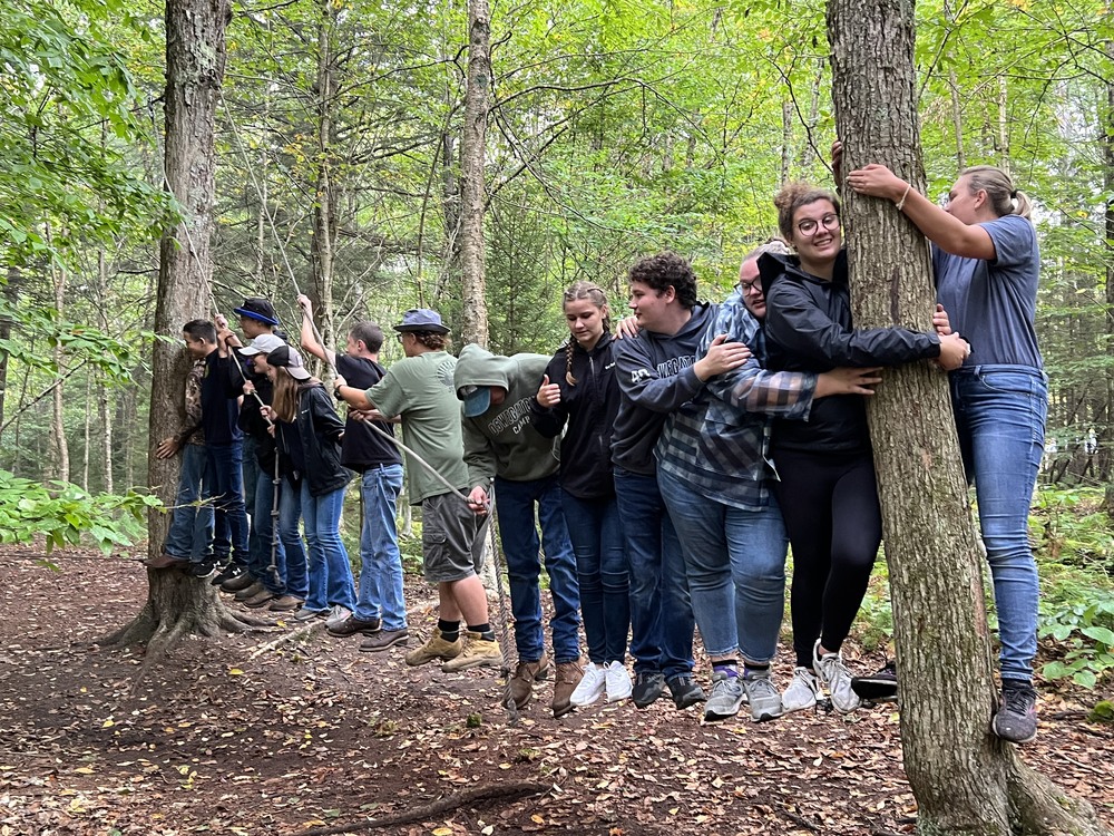 FFA members Emily Peters, Logan Lyons, Erika Conrad, Brooke Luck, Claire Zehler, Larissa Hyman and Beau Hyman navigate the low ropes Mowhawk Trail course at the Oswegatchie Educational Center in Croghan, NY. Members took their annual trip to Oswegatchie from Sept. 17 to 19. 