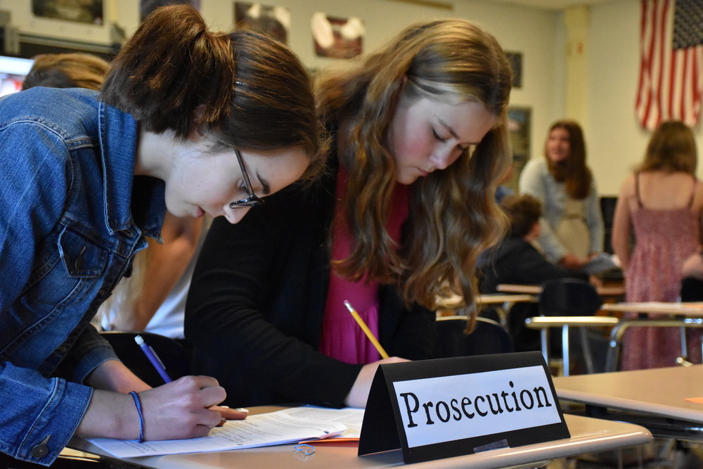 Students in Mrs. Judy Hruby’s 7th grade English class prepare their rebuttal during a trial to determine the sanity or insanity of The Narrator in Edgar Allan Poe’s “The Tell-Tale Heart.” The trial was a culminating activity on Poe’s short story and tasked students with advocating either for or against The Narrator’s sanity before a jury, which then rendered a verdict on which side had done the best job of using evidence in the story to make the most convincing argument. 