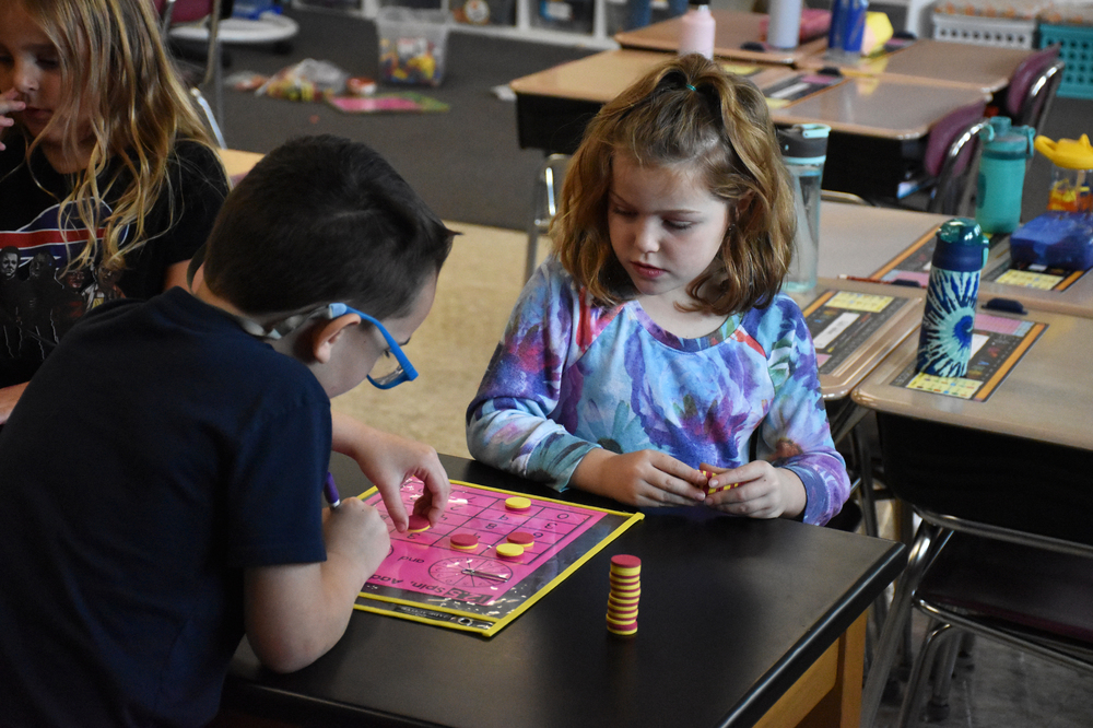 Students in Mrs. Nicole Parkhurst’s first grade math class play a math game during a trecent WIN Math lesson. 