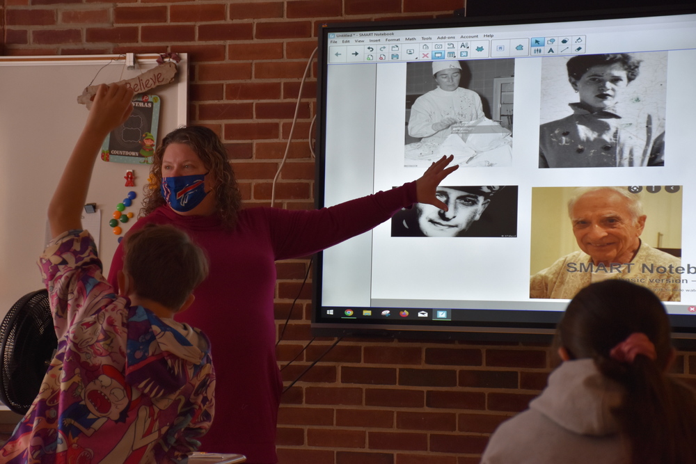   Mrs. Erin Holt put photographs of four people up on her Smartboard Thursday morning and challenged her middle school ELA students to identify who were the Nazis and who were the Jews. The exercise served as an object lesson in the difficulty of identifying evil. 