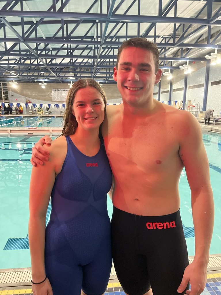 Libby Kibler and Joe Parkhurst pose for a photo at the Genesee Region League Swimming and Diving Championships Friday at Gates-Chili High School. 