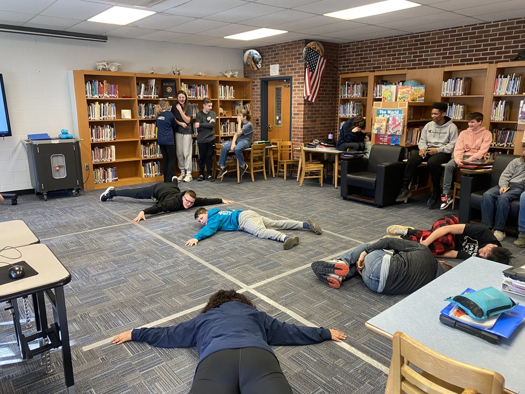 Attica eighth graders are pictured playing a human-sized game of tic-tac-toe meant to test their news media and information literacy knowledge. 