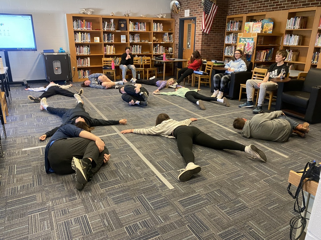 Attica eighth graders are pictured playing a human-sized game of tic-tac-toe meant to test their news media and information literacy knowledge. 