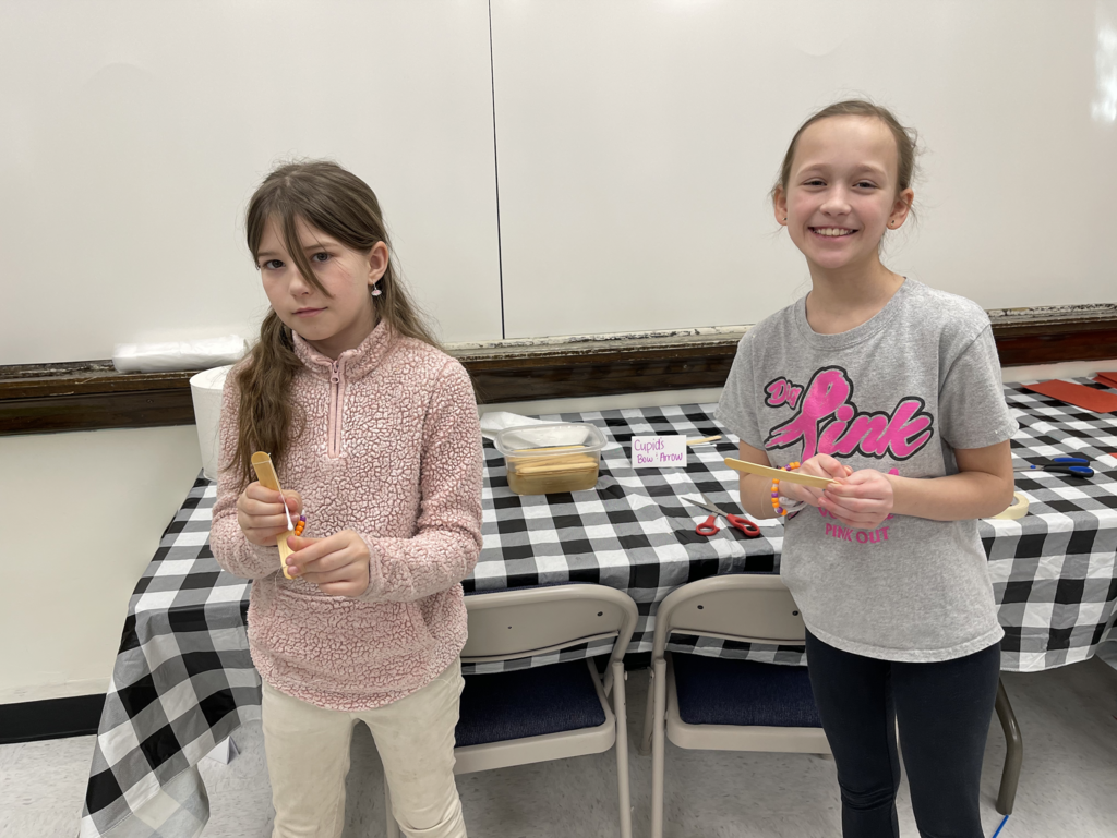 Fourth graders are pictured playing some Valentine’s Day-themed STEM challenges designed by Technology Integration Specialist Beth Falsone. 