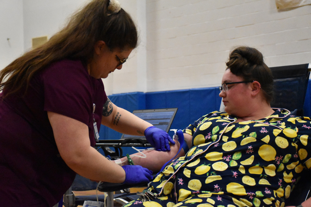 An Attica student is pictured giving blood at the ConnectLife blood drive Wednesday in the auxiliary gym. 