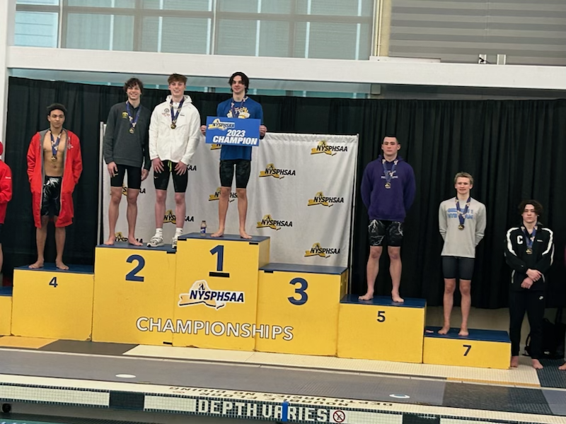 Joe Parkhurst on the podium following his 5th-place performance in the 50-free.