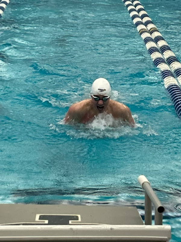 Joe Parkhurst is pictured competing in the 100-yard breaststroke at the New York State Swimming and Diving Championships at Ithaca College.