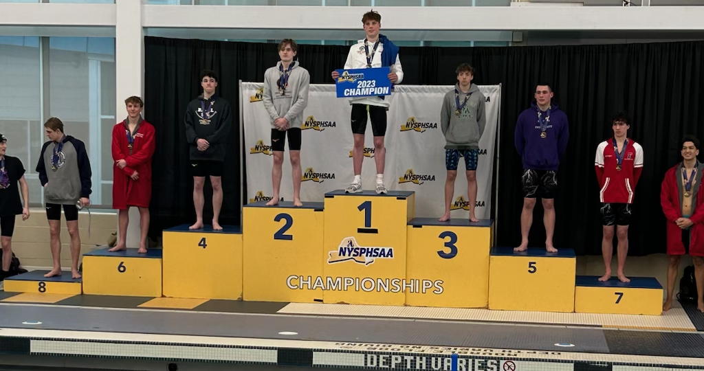 Joe Parkhurst is pictured on the 100-yard breaststroke podium at the New York State Swimming and Diving Championships at Ithaca College, 