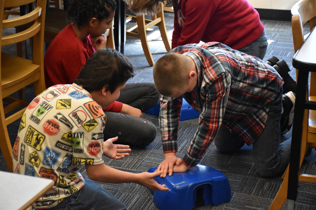 Attica fifth graders are pictured during a CPR lesson Wednesday in the Middle School Library. 