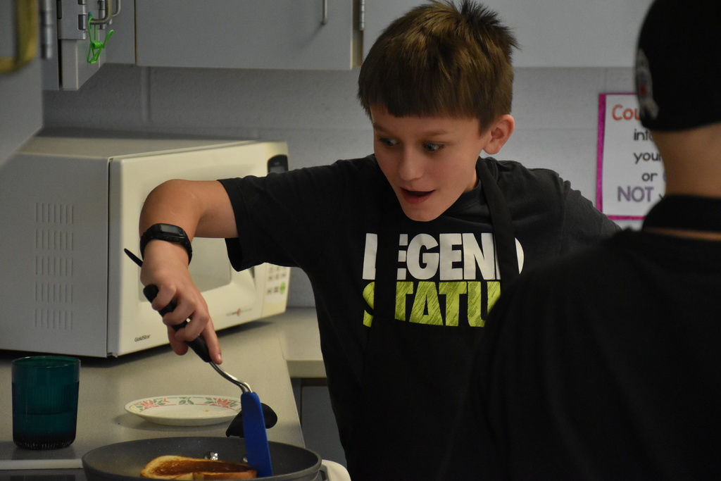 Middle school students in Becky Sphar’s home and careers class are pictured making grilled cheese Tuesday. 