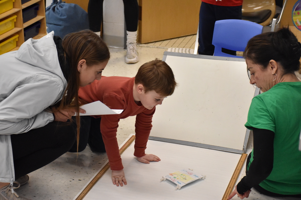 Elementary and high school students are pictured doing a STEM activity Tuesday morning at Attica Elementary School. 