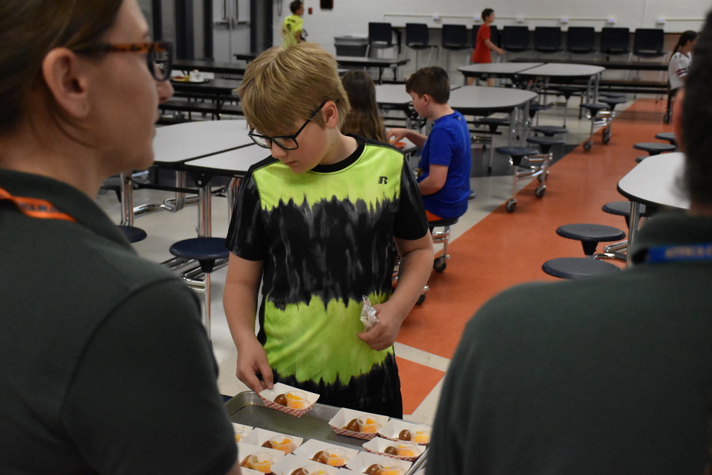 Students are pictured Friday during the Merle Maple taste testing. 