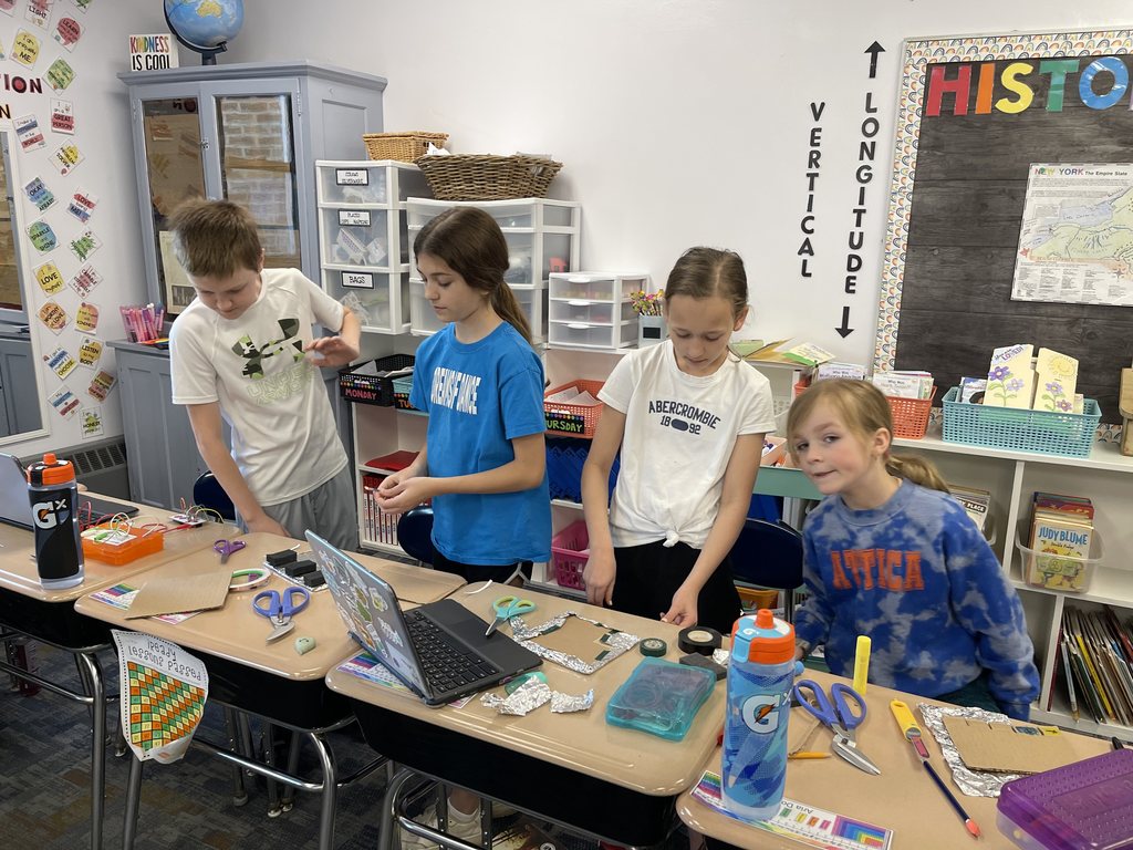 Attica fourth graders are pictured last week creating simple electrical circuits using Makey Makey invention kits.